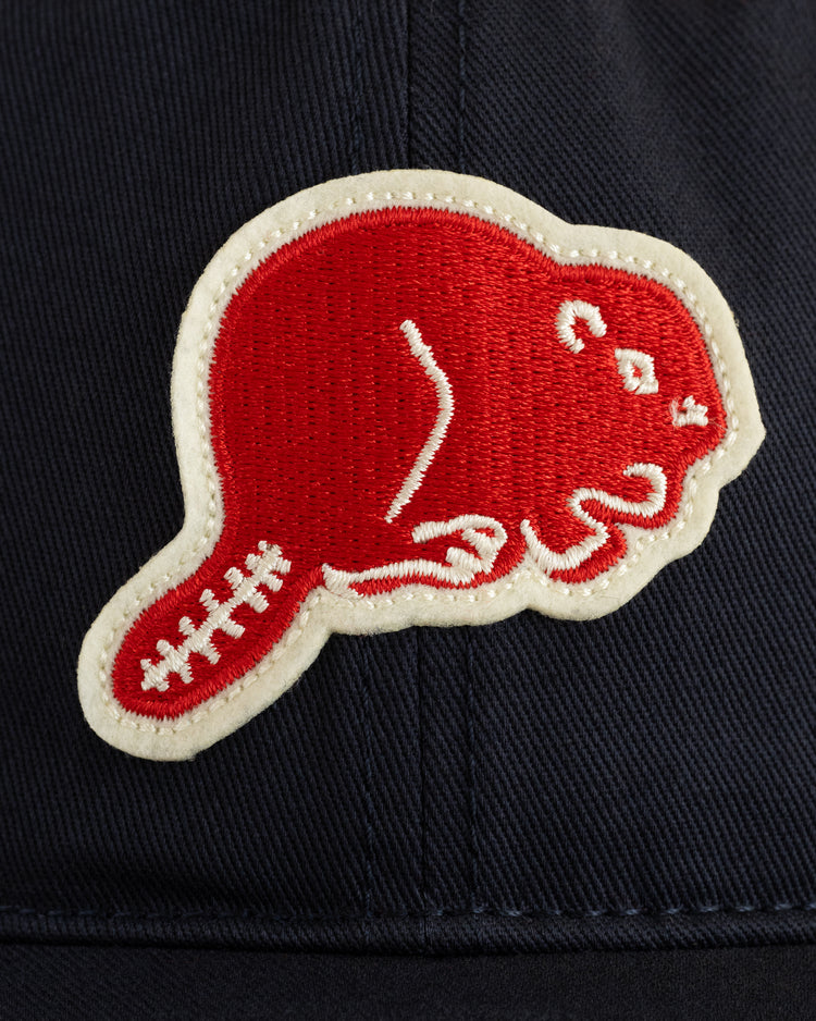 A red beaver patch outlined in white is sewn onto the dark cotton twill fabric of the EFF Portland Beavers Ballcap.