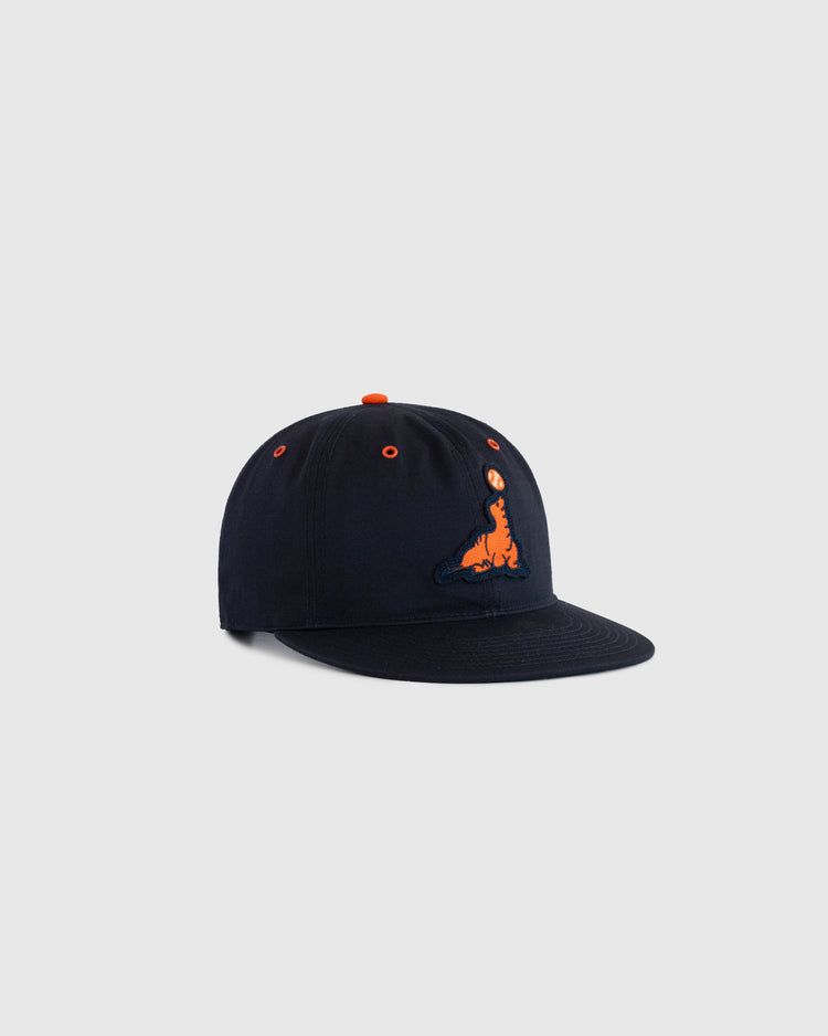 The EFF San Francisco Seals Cotton Twill Ballcap is a vintage black cap featuring an orange embroidered seal balancing a ball, matching orange eyelets and top button, shown on a light gray background.