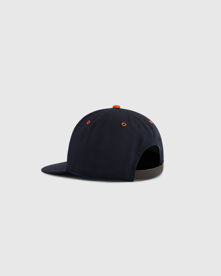 The EFF San Francisco Seals Cotton Twill Ballcap is shown from the back at an angle, featuring navy blue fabric, orange eyelets and button, an adjustable strap, and a light gray background.