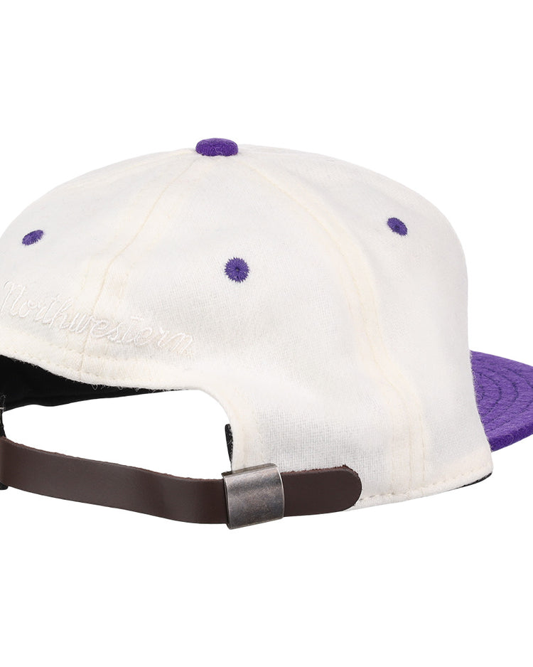 The EFF Northwestern University Vintage Ballcap is a white cap with purple accents and brim, an adjustable brown strap, and Northwestern embroidered above the back—perfect for Wildcats fans seeking vintage Ebbets Field Flannels style.