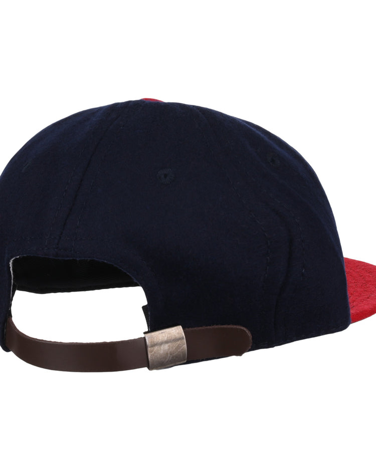 The EFF Oklahoma City Indians 1948 Vintage Ballcap is a navy wool cap with a red brim, brown adjustable strap, and metal clasp, shown from the back and inspired by classic Texas League style.