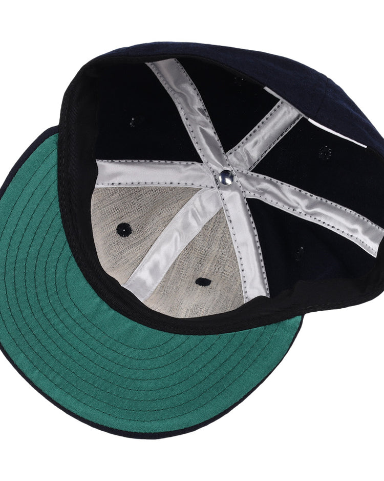 The inside of the EFF San Jose Red Sox 1952 Vintage Ballcap features a navy crown, green brim underside, white X-shaped fabric strips, and metal vents—classic details true to its original 1952 design.