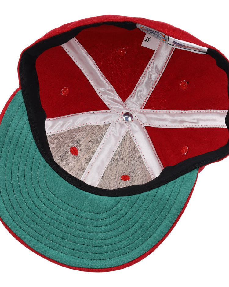 The EFF Greensboro Patriots 1922 Vintage Ballcap in red features a green underside brim, black trim, white internal stitching, and a silver center button.