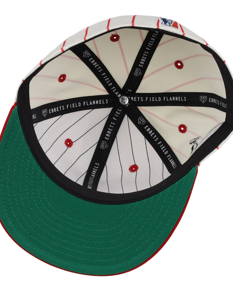 The EFF New Orleans Black Pelicans NLB Pinstripe Fitted Ballcap features a green underbrim, white inner panels with red pinstripes and dots, and black EBBETS FIELD FLANNELS bands, inspired by the Negro Southern League team.