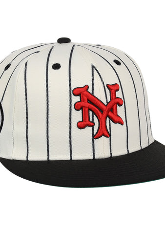 The EFF New York Cubans NLB Pinstripe Fitted Ballcap features white fabric with black pinstripes, a black brim, red interlocking NY logo, and a side patch—honoring the legacy of Black baseball and the Negro National League.