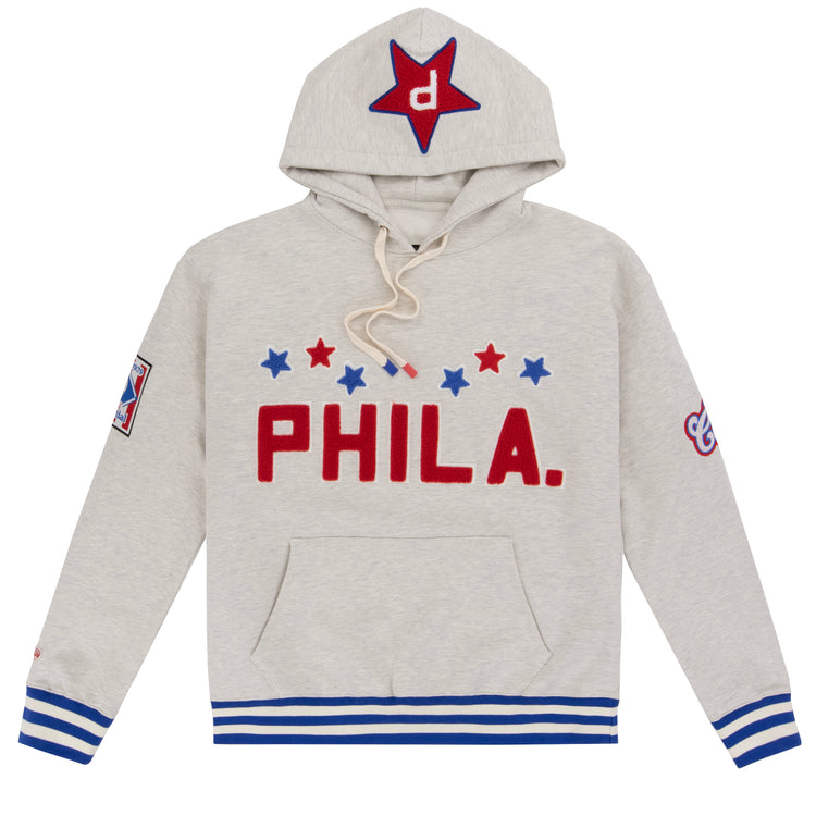 The EFF Cultural Excellence x Philadelphia Stars French Terry Hooded Sweatshirt features light gray streetwear style with red PHILA., blue and red stars, blue-striped cuffs, a star-detailed hood, and a sleeve patch—honoring Negro League legends.