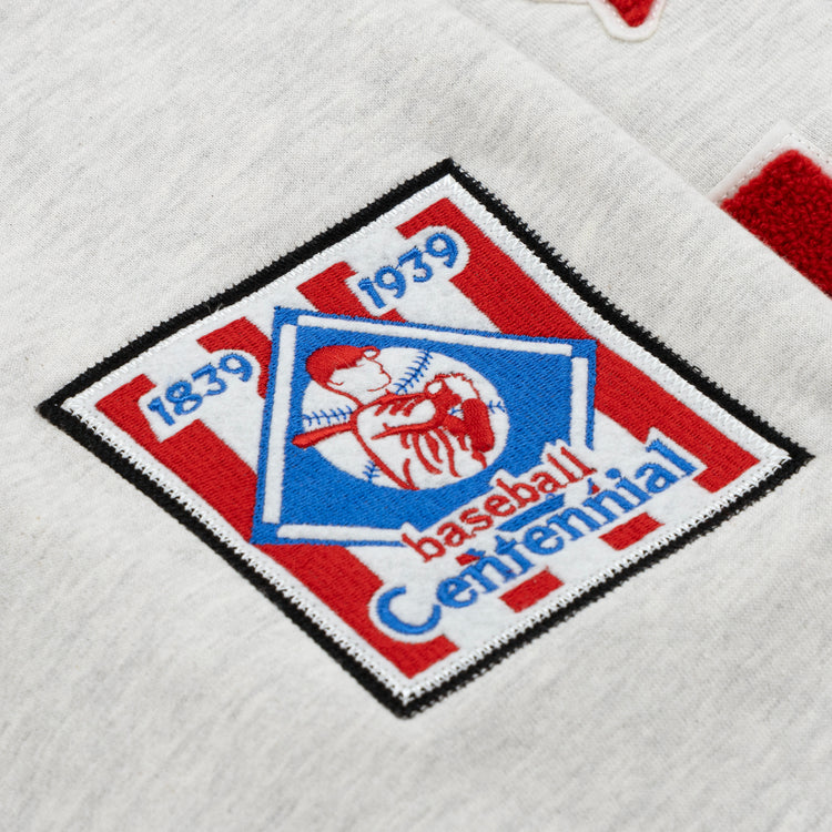 The EFF Cultural Excellence x Philadelphia Stars French Terry Hooded Sweatshirt features a patch inspired by Negro League Baseball, with 1839 1939 and Centennial around a red player silhouette in a blue diamond on red and white stripes—ideal for streetwear or collectors.