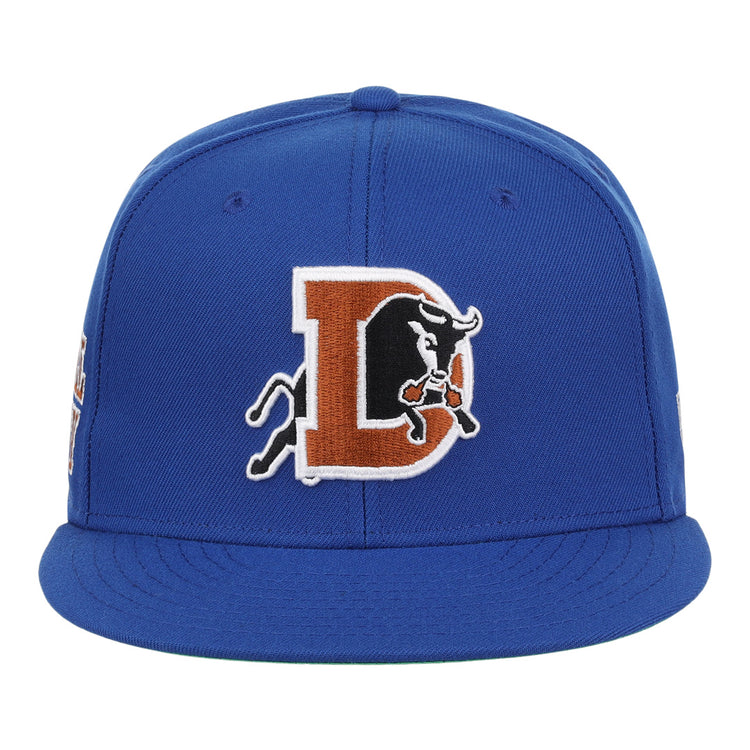 The Durham Bulls EFF MiLB Vintage Snapback by Ebbets Field Flannels is a blue adjustable cap featuring a large embroidered D with a charging black bull, inspired by the vintage Minor League style.