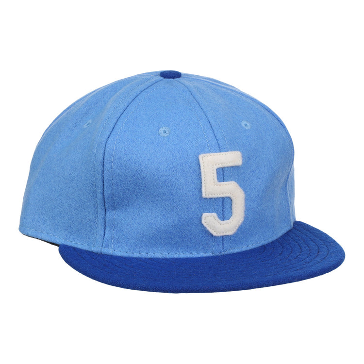 The Ebbets Field Flannels George Brett Signature Series Ballcap features vintage light blue wool, a dark blue brim, and a white number 5 on the front, inspired by classic styles from the National Baseball Hall of Fame.