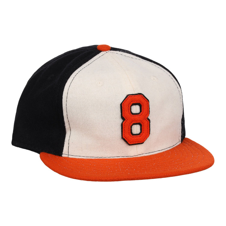 The Ebbets Field Flannels Cal Ripken Jr. Signature Series Ballcap features a vintage design with a black back, white front, orange brim and button, plus a bold orange number 8 outlined in black as tribute to Cal Ripken Jr.