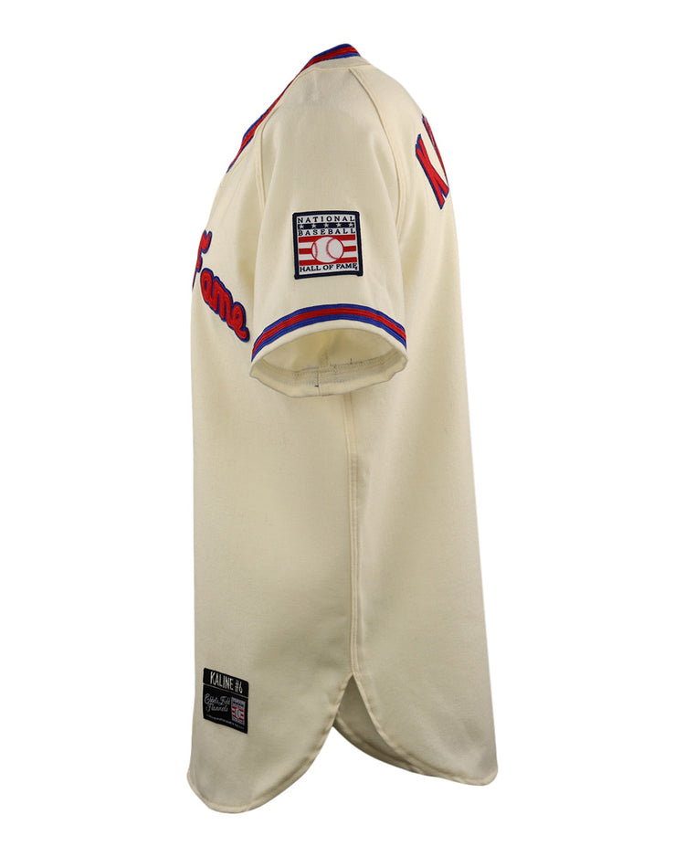 Side view of the EFF Al Kaline Hall of Fame Jersey in cream with red and blue trim, right sleeve patch, and black label by the hem. The front lettering and number are partly visible on this classic baseball jersey.