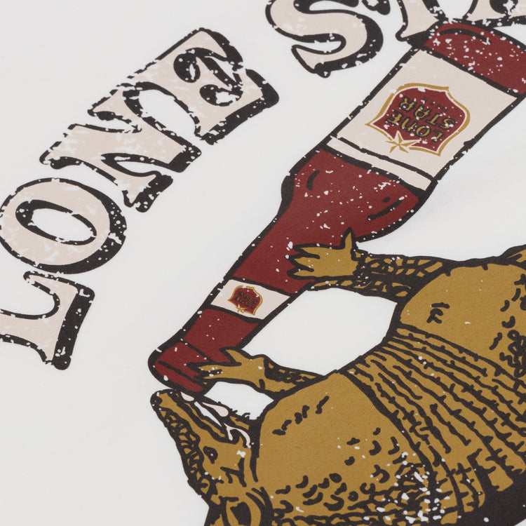 The Lone Star EFF Vintage Beer T-Shirt by Ebbets Field Flannels features a graphic of an armadillo drinking from a Texas beer bottle with bold, distressed Lone Star text on a white background.