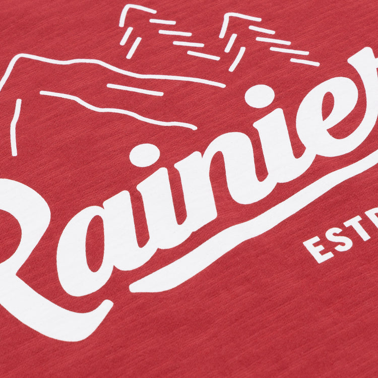 The Rainier EFF Vintage Beer T-Shirt by Ebbets Field Flannels features red fabric with a white mountain graphic and “Rainier” script—an iconic nod to Rainier Beer and Pacific Northwest heritage.