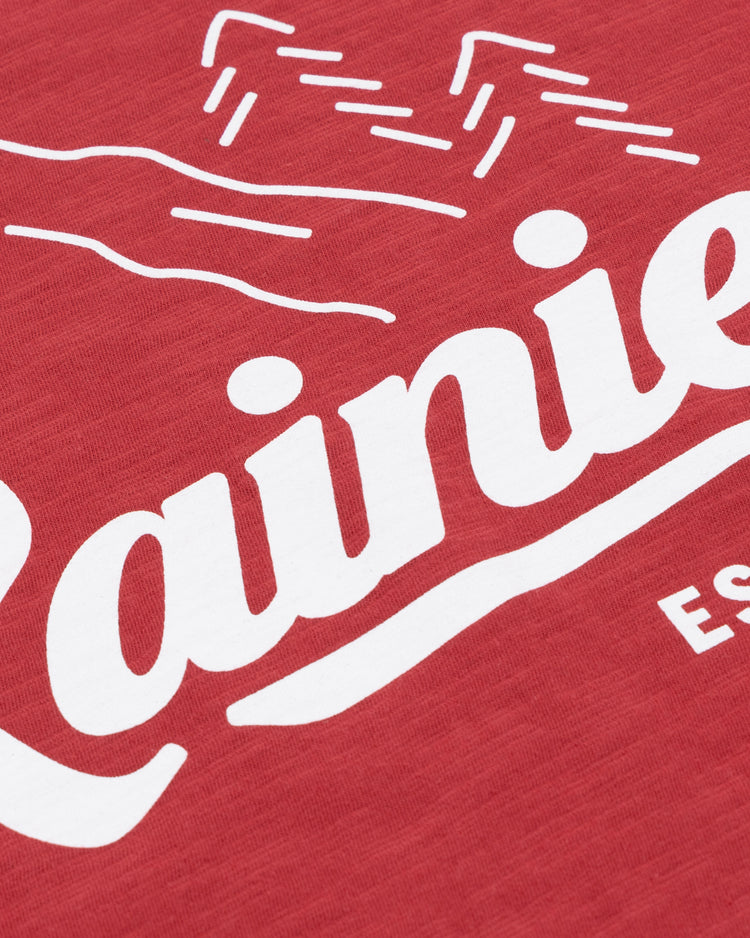 The Rainier EFF Vintage Beer T-Shirt by Ebbets Field Flannels features red fabric with a white mountain graphic and “Rainier” script—an iconic nod to Rainier Beer and Pacific Northwest heritage.