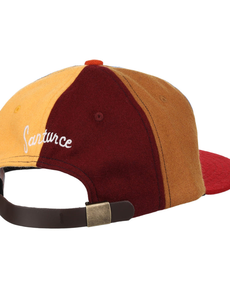 The EFF Santurce Cangrejeros Vintage Inspired Pinwheel Ballcap features yellow, burgundy, and brown panels, a red brim, adjustable brown strap with metal clasp, and white embroidery honoring Roberto Clemente.