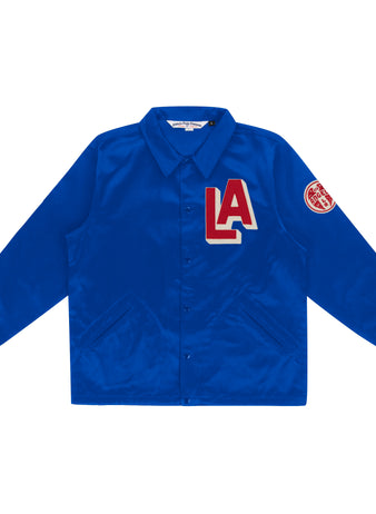 The EFF Los Angeles (PCL) Satin Windbreaker is royal blue with a button-up front, collar, bold red and white LA chest patch, and round red patch on the upper left sleeve—classic Pacific Coast League style.