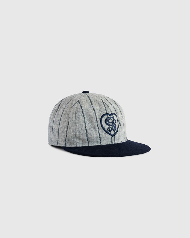The EFF Sacramento Senators Authentic Wool Ballcap features gray wool with dark vertical pinstripes, a navy brim, and a navy embroidered heart-shaped snake logo—an exact replica of the classic vintage design.