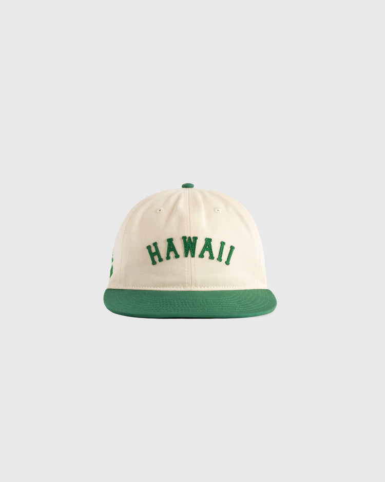 The Ebbets Field Hawaii Islanders (PCL) Cotton Twill Ballcap features a cream body, green brim, and HAWAII embroidered in green on the front, made from soft cotton twill and shown on a light gray background.