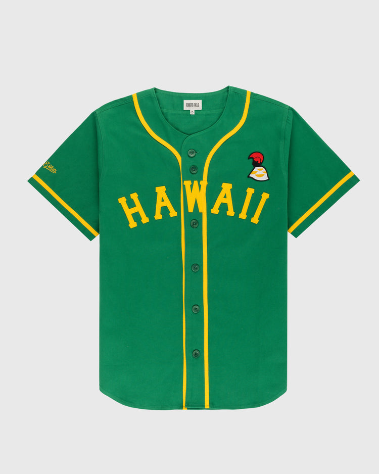 The Ebbets Field Hawaii Islanders (PCL) Cotton Twill Baseball Jersey features a green body with yellow trim, HAWAII in yellow capitals across the chest, a red and white patch above, short sleeves, and front buttons for a vintage look.