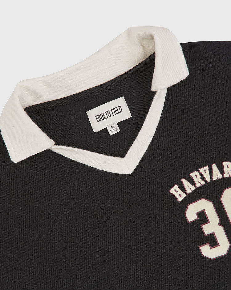 Black Harvard University Vintage Soccer Goalie Jersey by Ebbets Field, featuring a white collar, V-neckline, and the number 3 with part of “Harvard” visible on the front.