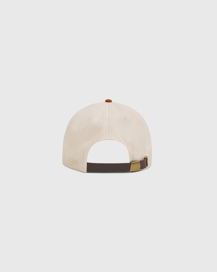 The Ebbets Field University of Texas Longhorns Cotton Twill Ballcap, shown from the back, showcases a brown adjustable strap with a gold buckle and a small red button on top—an ideal choice for fans wanting classic style and comfort.