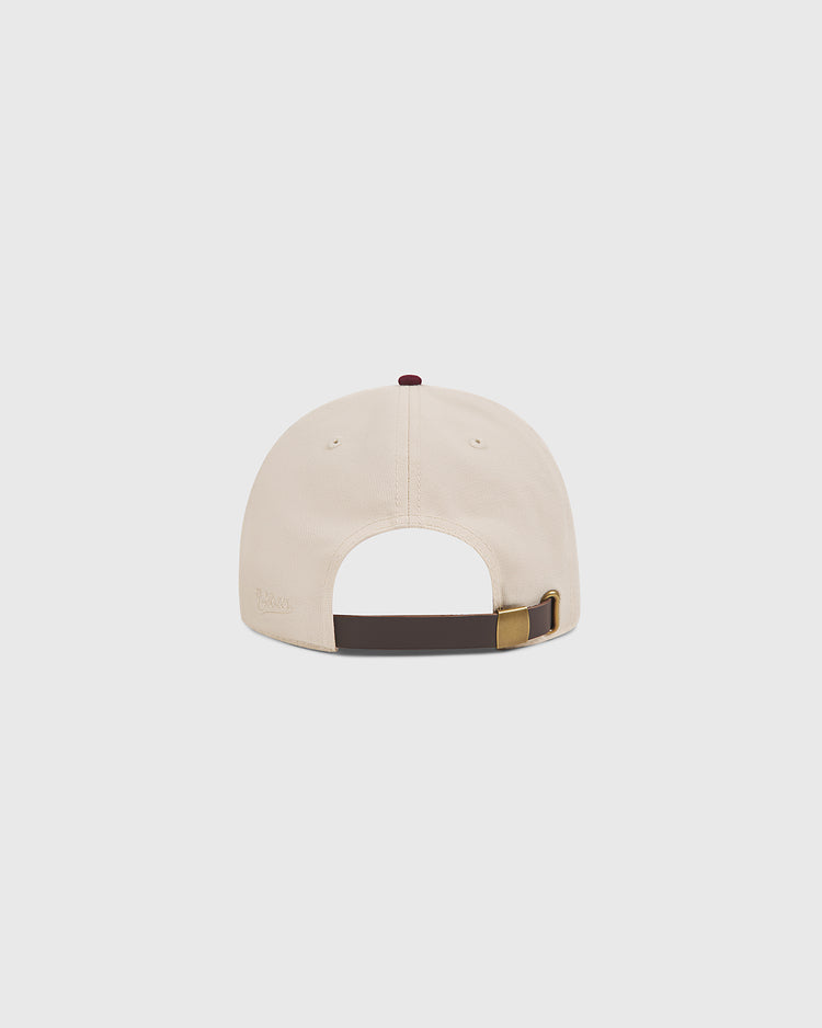 The Ebbets Field Texas A&M Sarge Cotton Twill Ballcap is pictured from the back, showcasing its adjustable dark brown strap with a brass buckle against a plain white background.