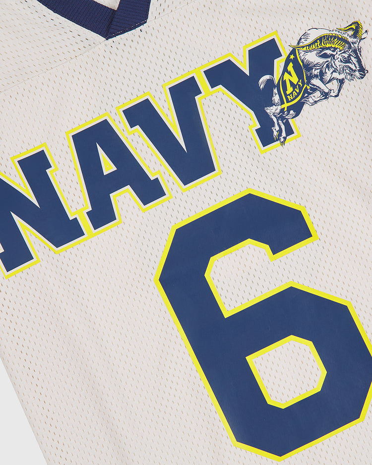 The Ebbets Field US Naval Academy Mesh Football Jersey showcases bold blue and yellow NAVY lettering, a standout goat mascot logo, and a large number 6 on white mesh fabric for an authentic vintage football look.
