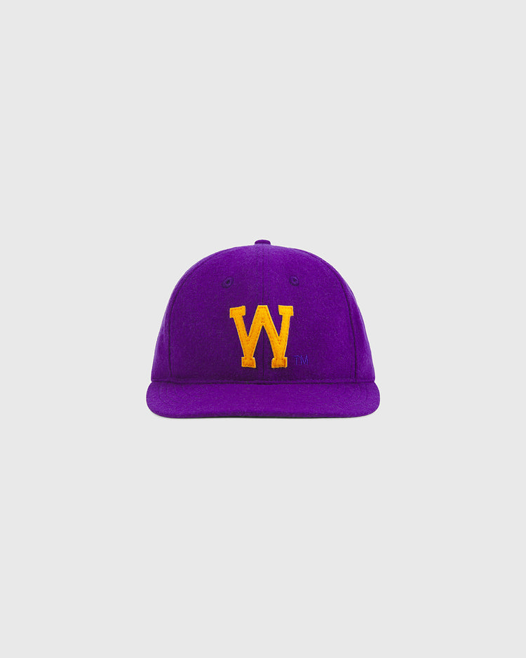 An Ebbets Field University of Washington Authentic Wool Ball Cap in purple, featuring a yellow embroidered “W” on the front and set against a plain light gray background. This classic wool cap is ideal for Huskies baseball fans and University of Washington supporters.