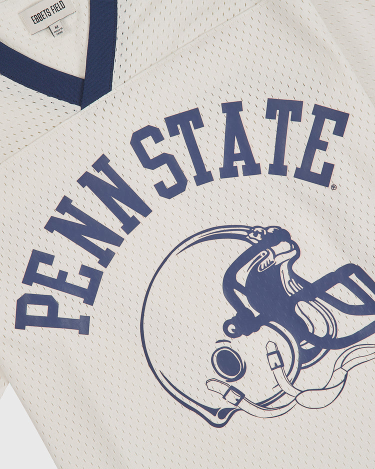 The Ebbets Field Penn State University Mesh Football Jersey showcases a white mesh design with navy trim and bold “PENN STATE” lettering above a football helmet graphic, capturing the classic style of vintage Penn State jerseys.