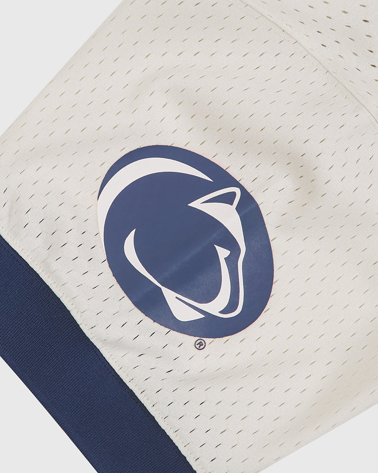 Show your Penn State pride with the Ebbets Field Penn State University Mesh Football Jersey—a white mesh jersey with navy blue trim and the classic Nittany Lions logo, featuring a stylized lion head in a navy oval. Perfect for fans who love that timeless vintage Penn State look.