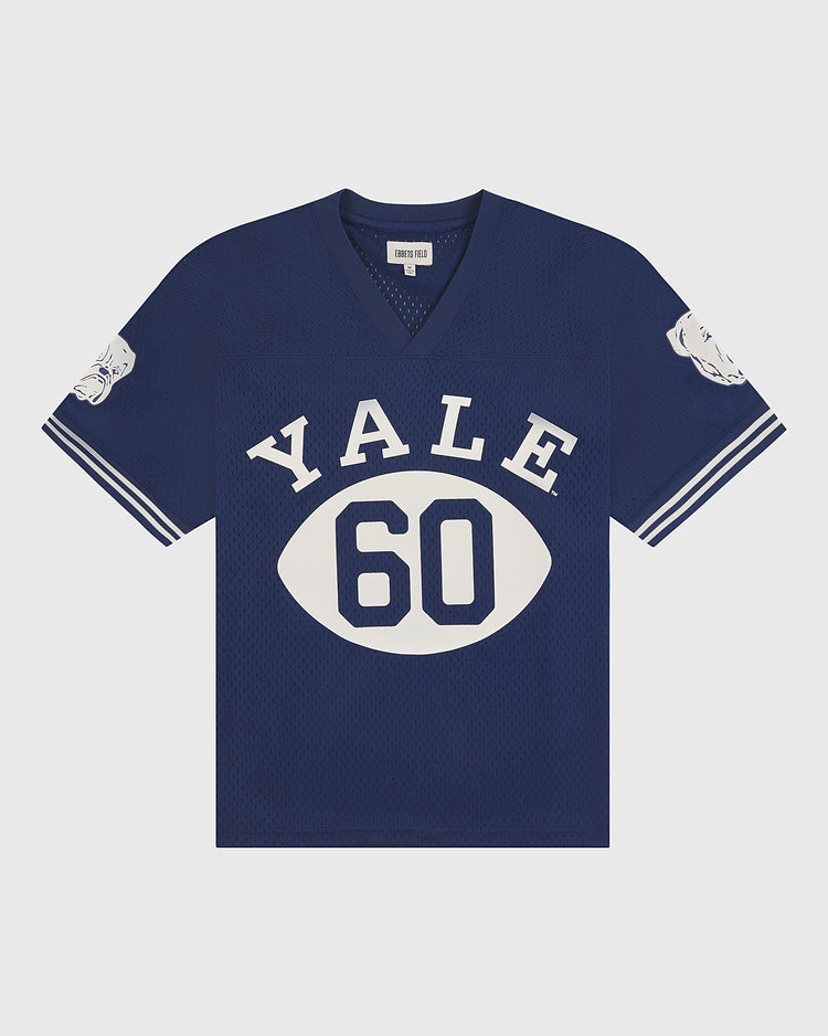 The Ebbets Field Yale Mesh Football Jersey features a classic blue vintage design with bold white YALE lettering, the number 60, and distinctive bulldog faces on each sleeve. This authentic game day jersey offers a V-neck and white sleeve stripes for true Yale Bulldogs style.