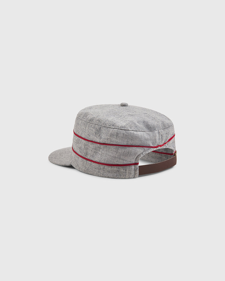A back view of the Ebbets Field Harvard University 1899 Pillbox Wool Ballcap, featuring a gray design with a short brim, two thin red stripes, an adjustable brown strap, and a small button on top.