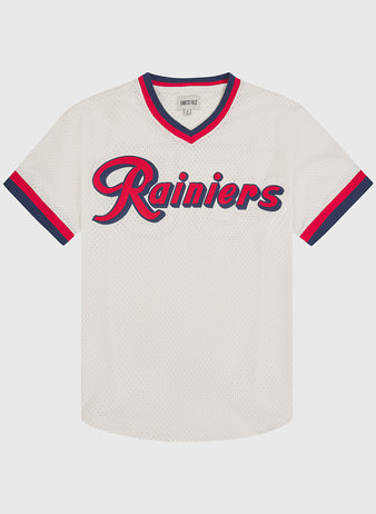 The Seattle Rainiers 1955 Mesh V-Neck Home Jersey by Ebbets Field features a white design with “Rainiers” in red and navy blue script across the chest, accented by navy and red stripes on the sleeves and collar.