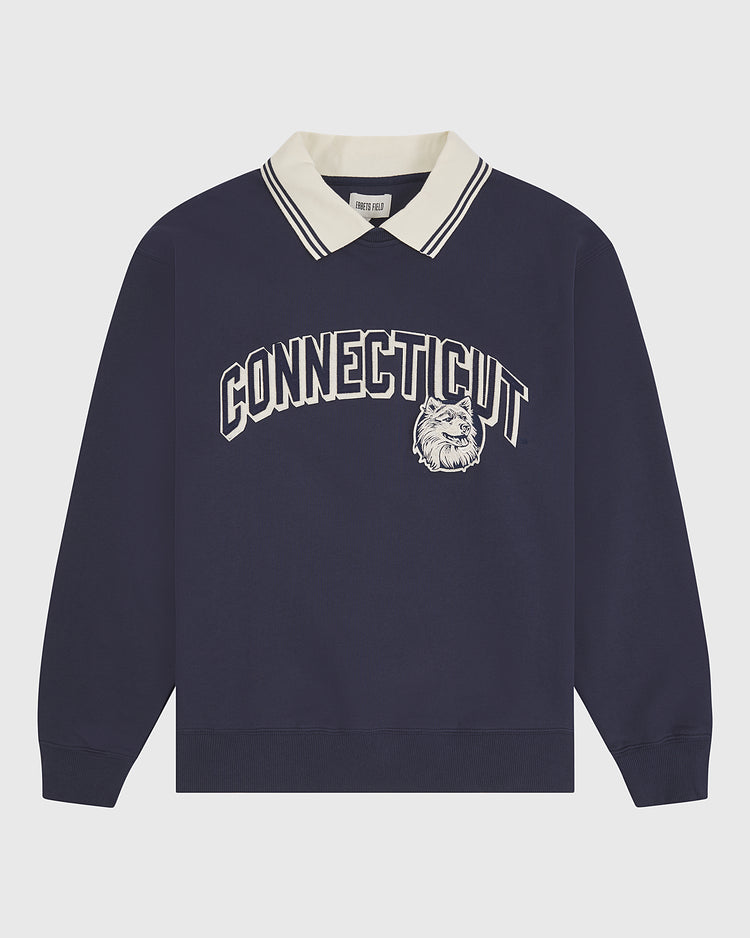 The University of Connecticut Collared Crewneck by Ebbets Field features a navy blue long-sleeve design with a cream collar, bold white “CONNECTICUT” lettering, and a bulldog graphic on the front.