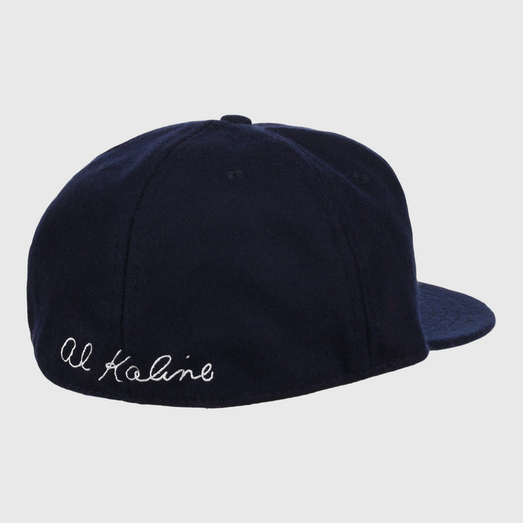 The Al Kaline Signature Series Ballcap by Ebbets Field Flannels is a navy vintage wool cap, shown from the back left, with Al Kaline’s signature embroidered in white cursive near the edge.
