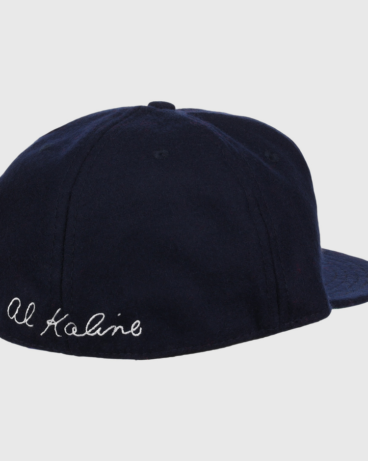 The Al Kaline Signature Series Ballcap by Ebbets Field Flannels is a navy vintage wool cap, shown from the back left, with Al Kaline’s signature embroidered in white cursive near the edge.