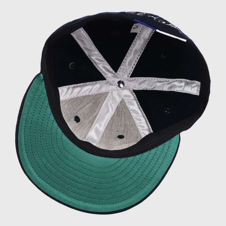 Top-down view of the Al Kaline Signature Series Ballcap by Ebbets Field Flannels, featuring silver inner seams, a green underbrim, and classic black and grey wool—reminiscent of caps in the National Baseball Hall of Fame.