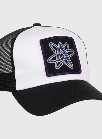 The Ebbets Field Albuquerque Isotopes MiLB Trucker Ballcap features a black mesh back, black bill, and white front with a purple and gray atomic symbol patch.