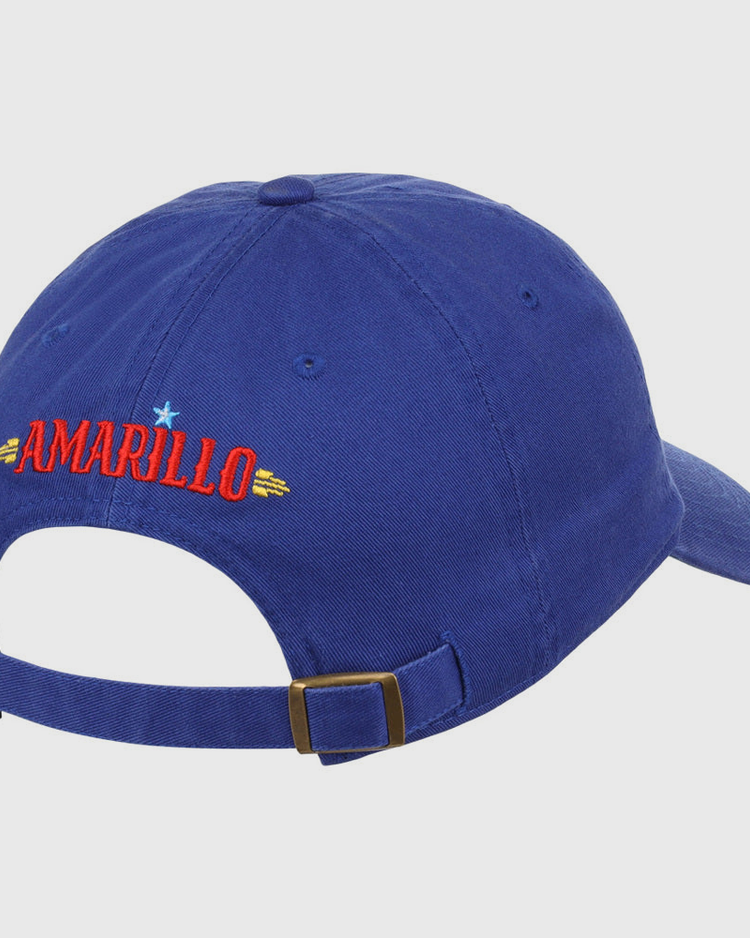 The Ebbets Field Amarillo Sod Poodles MiLB Dad Ballcap is a blue cap with an adjustable strap and buckle. 