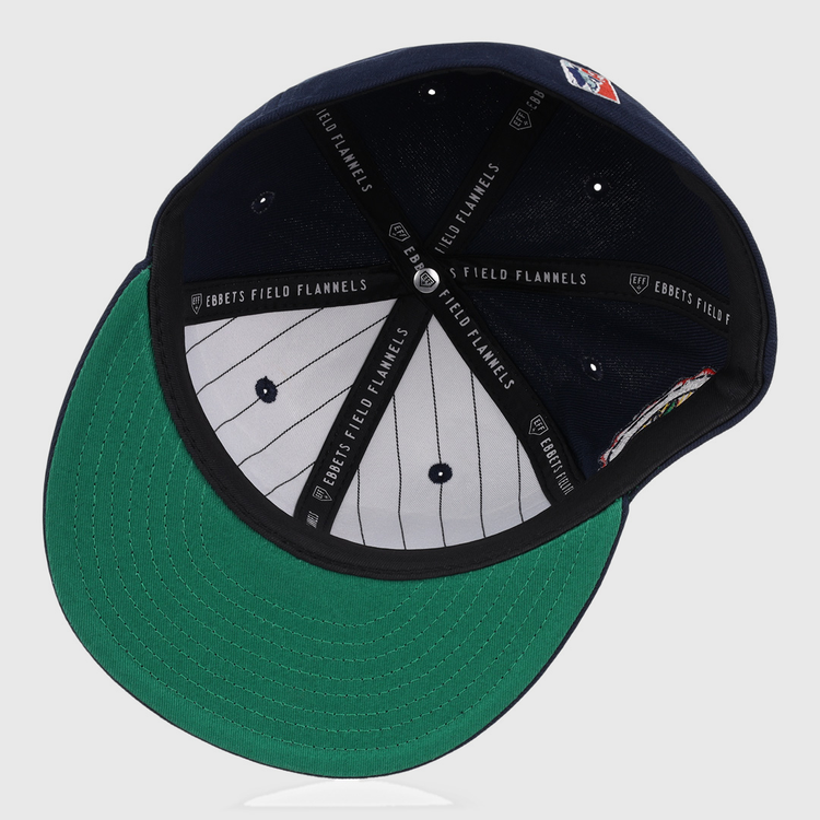 An inside view of the Atlanta Black Crackers NLB Team Color Fitted Ballcap by EFF, featuring a green underbill, black EFF-marked sweatband, grey pinstriped lining, and visible top button with vent holes.