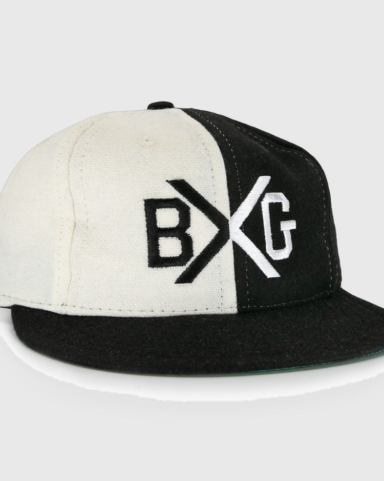 The EFF Bacharach Giants 1924 Vintage Ballcap is crafted from genuine wool and features black and white color blocks, a flat brim, and bold BXG embroidery on the front, inspired by the classic 1924 design.