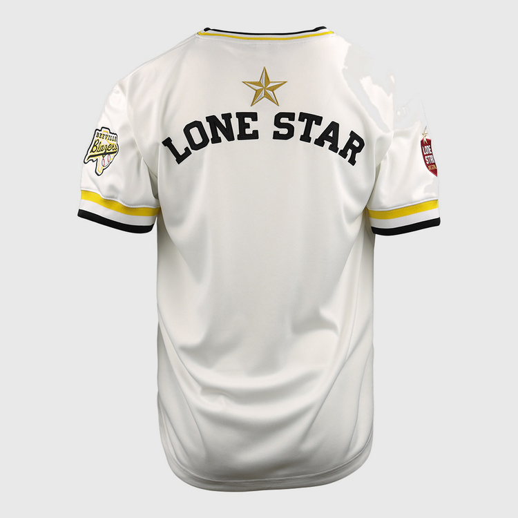 The EFF Beeville Blazers Lone Star Baseball Jersey is white with yellow and black trim, LONE STAR in bold black letters, a gold star on the back, and sleeve patches inspired by Joe Hunter Field in Corpus Christi.