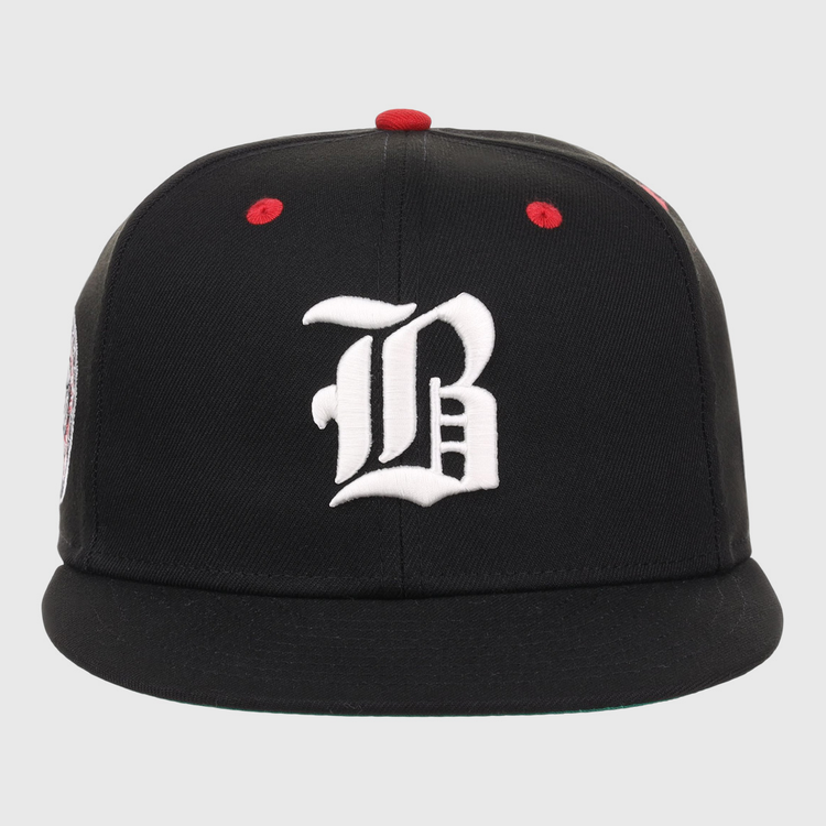 The EFF Birmingham Black Barons NLB Flip Fitted Ballcap features a black design with a bold white B and red accents, inspired by the historic Negro National League team.