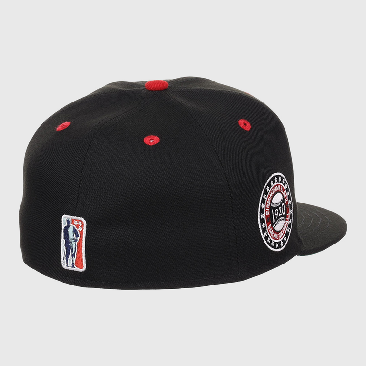 The EFF Birmingham Black Barons NLB Flip Fitted Ballcap features black fabric, red stitching, a side patch embroidered with 1920, and a small red, white, and blue batter logo on the back—honoring the Negro National Leagues legacy.