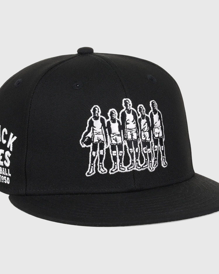 The Black Fives Fitted Ballcap by Ebbets Field Flannels features an embroidered outline of five vintage basketball players and BLACK FIVES BASKETBALL 1904-1950 on the side, honoring Black Fives history and Ebbets Field Flannels heritage.