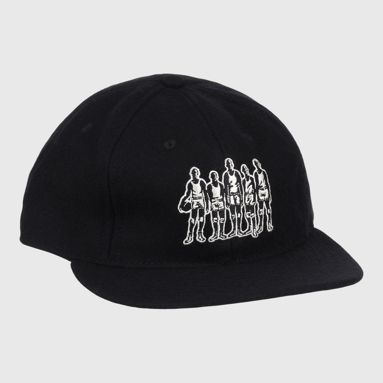 The Black Fives Wool Ballcap by Ebbets Field Flannels is a black vintage-inspired baseball cap featuring a white outline graphic of five people standing in a row on the front, celebrating the legacy of the Black Fives.