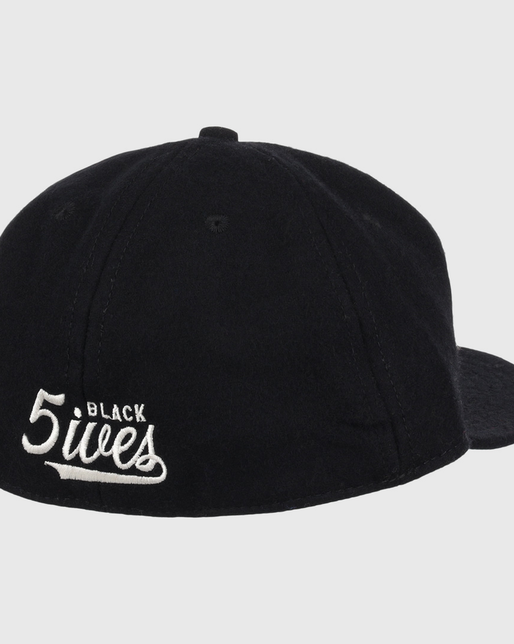 The Ebbets Field Flannels Black Fives Wool Ballcap features white embroidered BLACK 5ives text on the back, blending vintage ballcap style with Black Fives legacy.