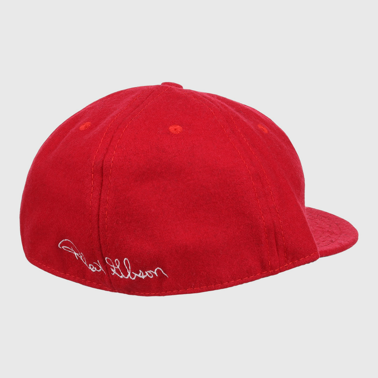 The Bob Gibson Signature Series Ballcap by Ebbets Field Flannels is a bright red vintage wool cap with white cursive embroidery near the adjustable strap, shown from the side and back against a white background.