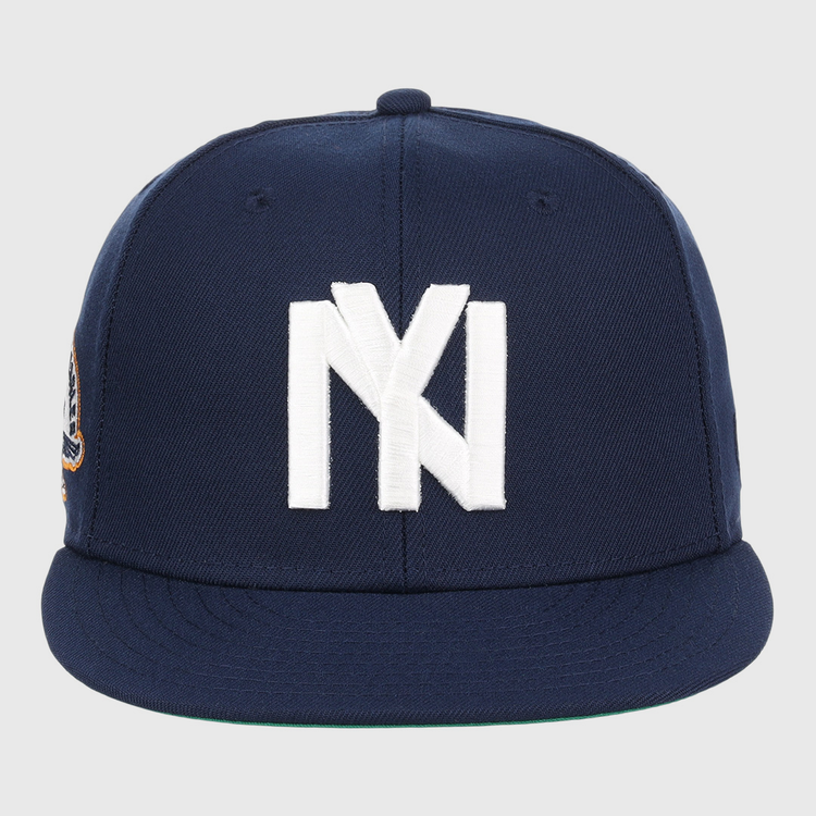 The EFF Brooklyn Eagles NLB Team Color Fitted Ballcap is a navy cap with a large white NY logo on the front, a flat brim, and a small patch on the left side.