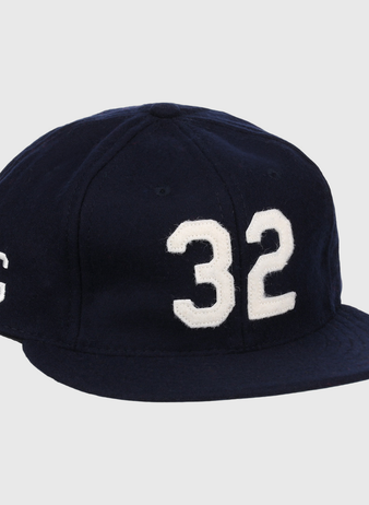 The Buck Leonard Signature Series Ballcap by Ebbets Field Flannels is a vintage navy wool cap with bold white 32 on the front and a white G on the side, honoring Buck Leonard’s legacy in the Negro Leagues.